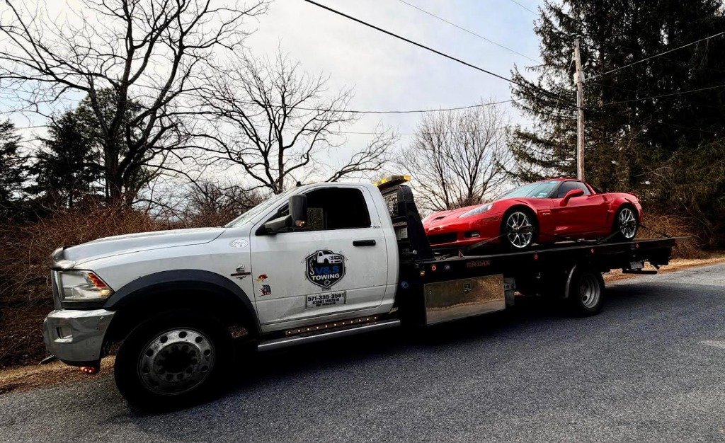 V&S Tow Truck transporting a Corvette C6